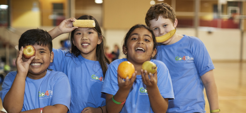 Children holding fruit